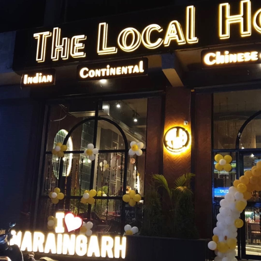 Night facade with glowing I Love Naraingarh sign